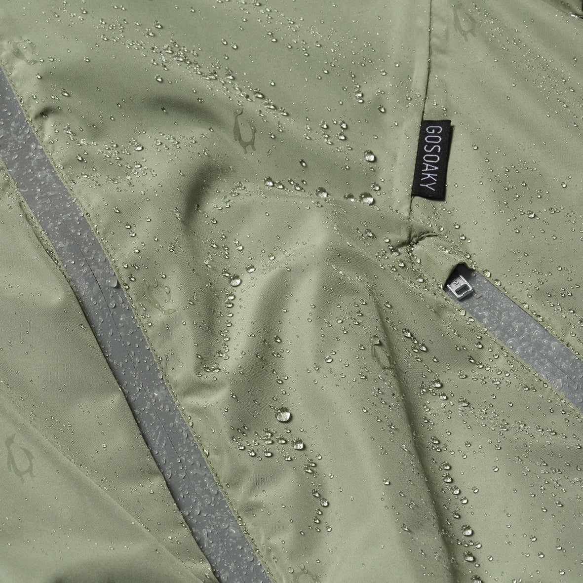 Kid wearing GOSOAKY HAPPY HORSE Stowable Waterproof Jacket color oil green - from Outerwear collection of Spring / Summer 2026